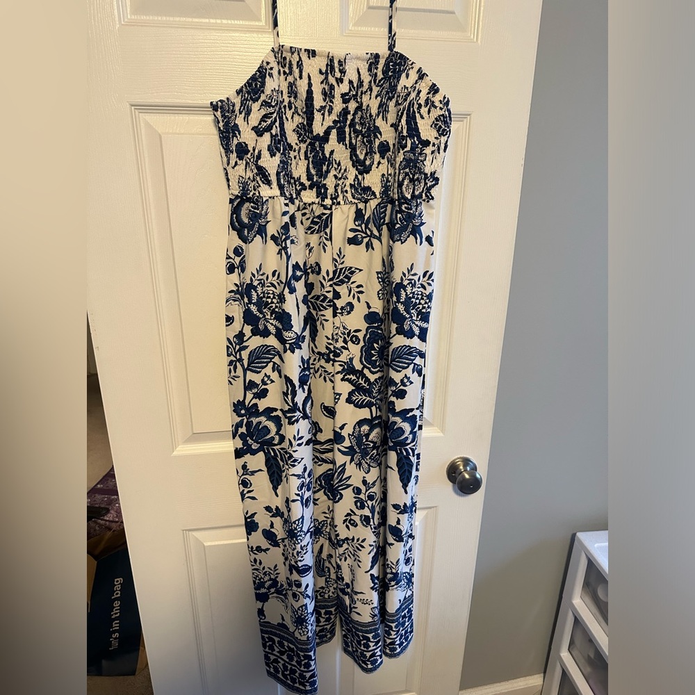 Spaghetti strap jump suit. Blue and white in color